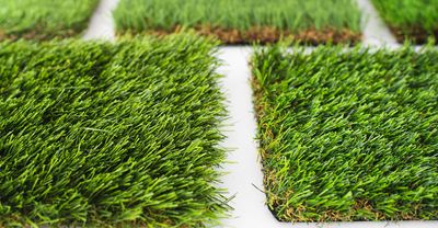 Artificial turf yard with landscaping and edging